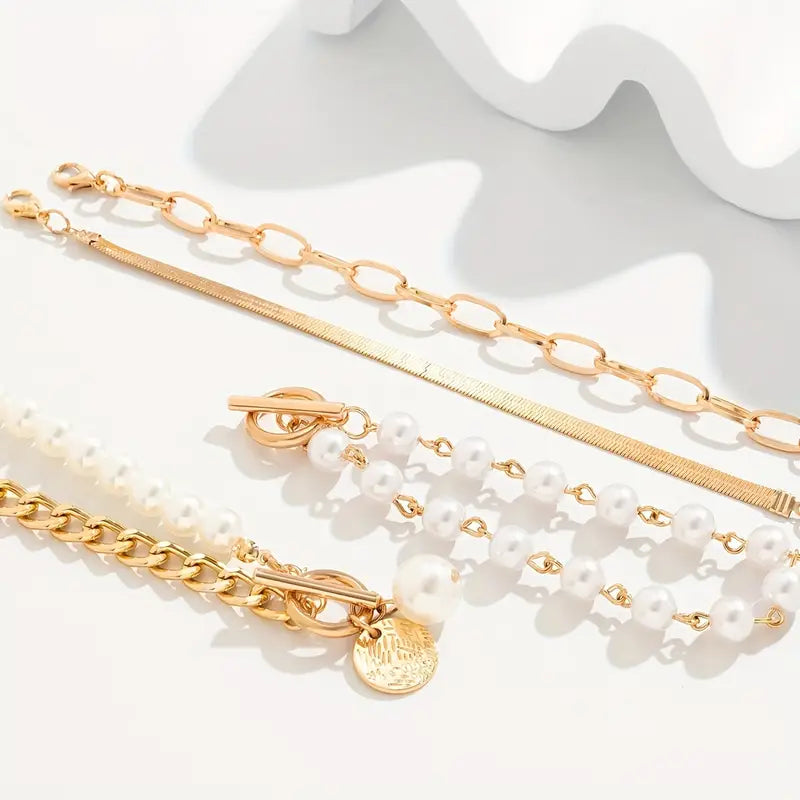 Elegante set de pulseras doradas (4 piezas) – serpiente, perlas y eslabones