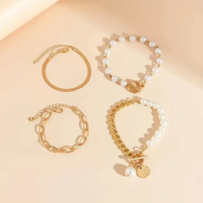 Elegante set de pulseras doradas (4 piezas) – serpiente, perlas y eslabones